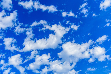 Obraz premium White fluffy clouds in the blue sky