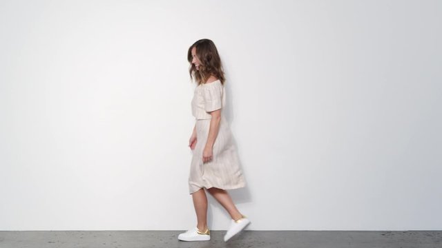 Woman in White Dress Line dancing and Spinning Around while Laughing 