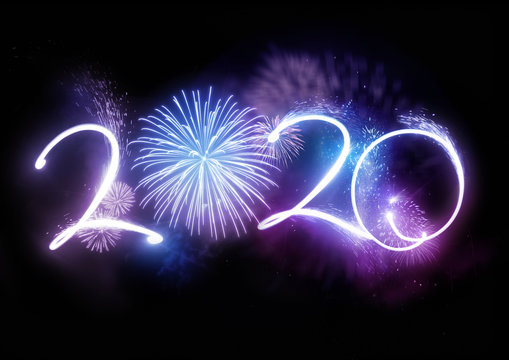 The year 2020 displayed with fireworks and strobes. New year celebration concept.