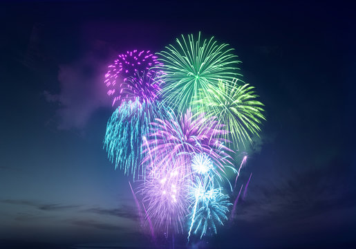 Bright and vividly coloured fireworks display celebrations background.