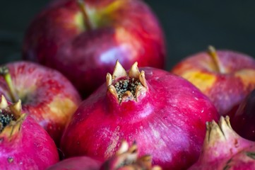 Raw and ripe purple pomegranate fruits close up image, a concept for a Rosh Hashanah Jewish New Year image. 