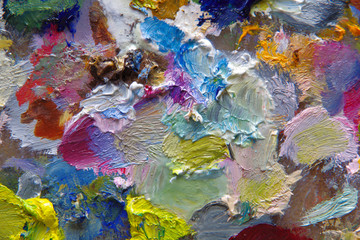 Fototapeta na wymiar oil paint of different colors on the artist’s palette.