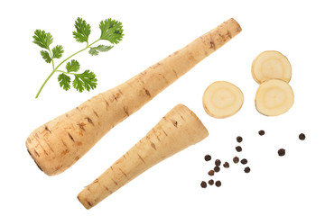 Parsnip root and slices with parsley peppercorns isolated on white background closeup. Top view. Flat lay