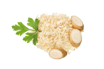 Horseradish root with slices grated pile and parsley isolated on white background. Top view. Flat lay.