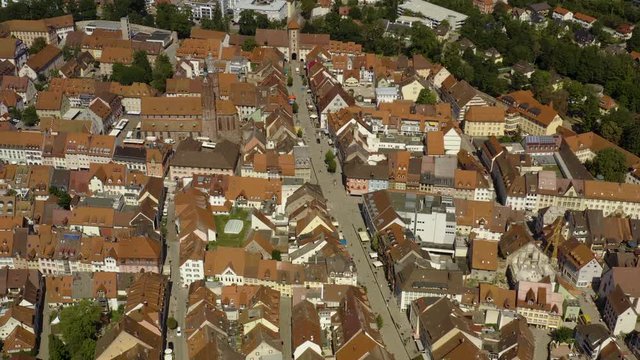 Aerial view of the city Villingen-Schweningen in Germany in the black forest on a sunny day in summer. Zoom out from the old town.