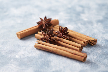 Star anise with cinnamon. Christmas spices on rustic wooden background. Close up. 