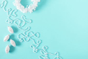 Christmas holiday composition. Xmas white decorations on pastel blue background. Christmas, New Year, winter concept. Flat lay, top view, copy space