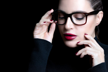 Beautiful woman with braided hair wearing glasses. vision correction, optometry and fashion eyewear...