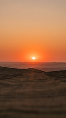 Fototapeta na wymiar Sunset in Ica-Peru. Orange colors