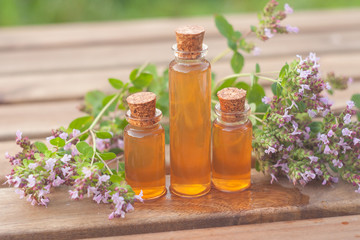 Essence of lavender flowers on table in beautiful glass Bottle