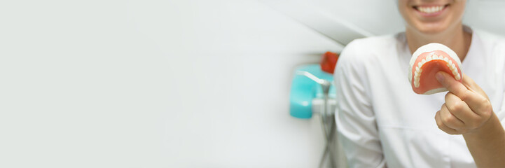 tools in the dental office. blurred background. dentist tools. dentist doctor holds in his hand tools for repairing teeth