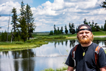 Young red bearded man in the outdoors