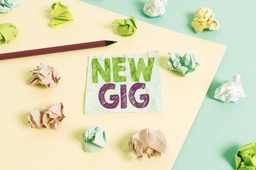 Handwriting text New Gig. Conceptual photo getting job Attending live Concert Gigabyte Freelancer offer Colored crumpled papers empty reminder blue yellow background clothespin