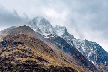 Beautiful Himalaya mountains covered with snow and wrapped in fog, Manaslu Circuit Trek.