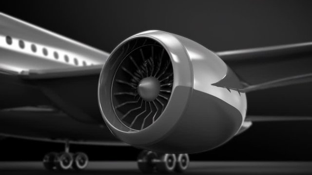 Airplane engine starts up, close-up on rotating turbine