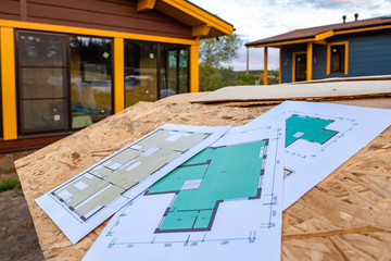 Drawings of the building next to the finished cottage. Architectural and construction drawing....