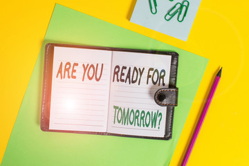 Conceptual hand writing showing Are You Ready For Tomorrow Question. Concept meaning Preparation to the future Motivation Locked diary striped sheets clips notepad colored background