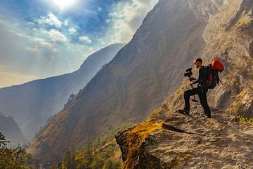 Male trekker in Himalayan mountains and forests in Manaslu region, Nepal.	