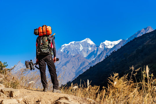Male trekker in Himalayan mountains and forests in Manaslu region, Nepal.	