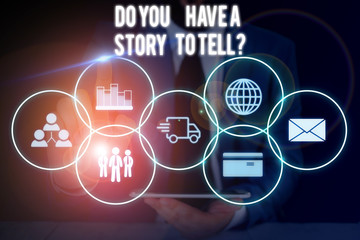 Conceptual hand writing showing Do You Have A Story To Tell Question. Concept meaning Storytelling Memories Tales Experiences Male wear formal suit presenting presentation smart device