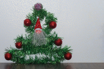 stylized Christmas tree from a garland with toys