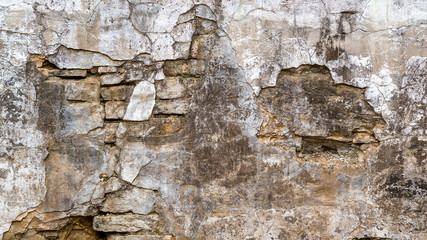 background of a damaged stone wall