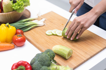 Close up woman preparing ingredient for salad.