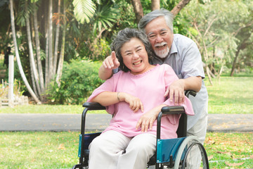Happy elderly couple with lifestyle after retiree concept. Lovely asian seniors couple embracing together in the park in the morning.