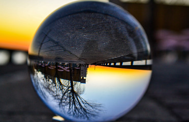 Glass globe reflecting sunset