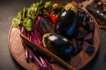 Brinjal Eggplant or science name Solanum melongena Linn with several vegetable on wooden plate for the ingredients cook healthy food