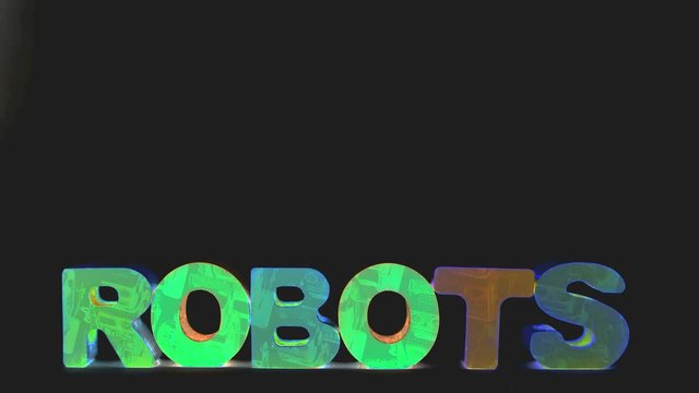 The  word ROBOTS with robots  isolated on black