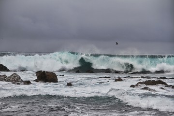 waves breaking on the rocks
