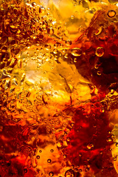 cola drink with ice cubes texture and bubble as a abstract background