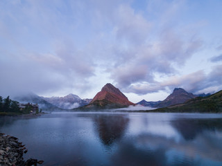 Fototapeta na wymiar Sunrise of the Mount Wilbur, Swiftcurrent Lake in the Many Glacier area of the famous Glacier National Park