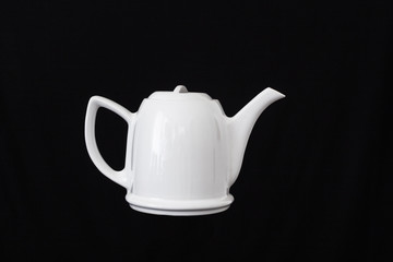 white coffee pot on black rustic background