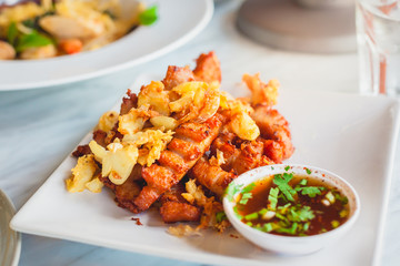 Fried crispy pork with garlic and spicy dipping sauce