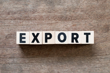 Fototapeta premium Letter block in word export on wood background