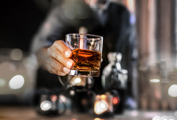 Bartender Serve Whiskey, on wood 