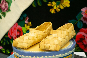 Russian folk art. Wicker bast shoes on sale exhibition