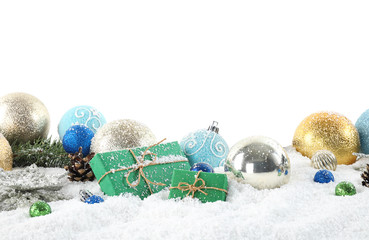 Fir branches, Christmas decoration and snow against white background