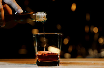 Bartender Serve Whiskey, on wood bar