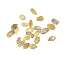 Raw peeled pumpkin seeds on white background, top view
