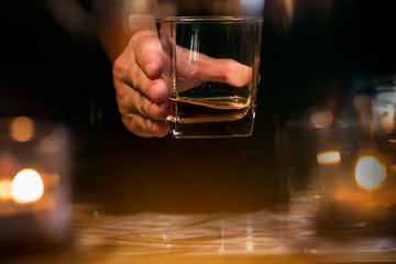 Bartender Serve Whiskey, on wood bar