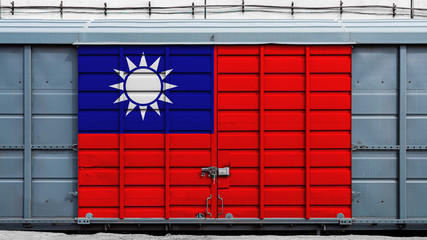 Front view of a container train freight car with a large metal lock with the national flag of Taiwan.The concept of export-import,transportation, national delivery of goods and rail transportation