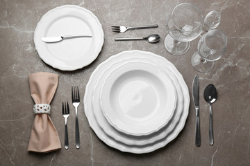 Elegant table setting on marble background, flat lay