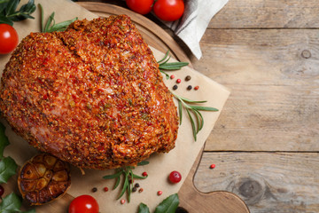 Homemade delicious ham on wooden background, flat lay with space for text. Festive dinner