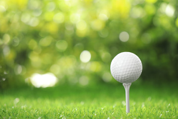 Golf ball on tee at green course