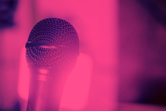microphone for vocals in a retro style on blurry pink background