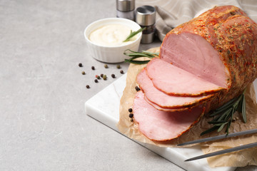 Delicious ham served on grey table. Space for text