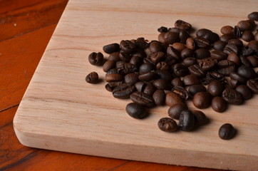 Background coffee beans on wood with empty space for text